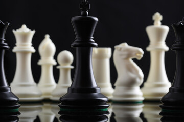 chess pieces on chessboard on marble background. game of chess