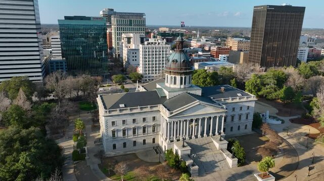 Rotating aerial footage of the SC statehouse with Columbia, SC in the background.