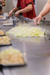 Cabbage teppanyaki is a comforting and flavorful dish that highlights the natural sweetness and crunch of fresh cabbage. Cooked on a sizzling iron plate, the leaves are charred just enough to release