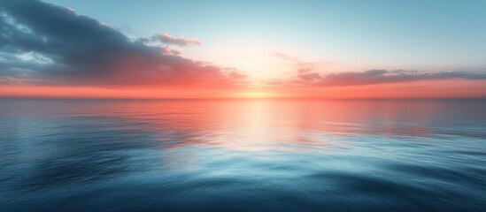 Obraz premium Serene Sunset Over Calm Ocean