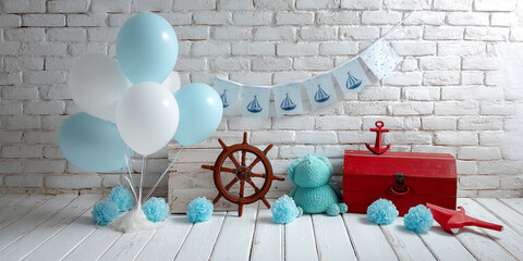 Baby boy's nautical themed photoshoot setup, featuring balloons, ship wheel, chest, and anchor against a brick wall.  Showcase for birthday or event photography. © PhotoArtHub