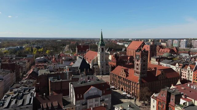 Aerial view on sunny day of historical tourist center of medieval city Torun, old town, churches, cathedrals and Vistula river, Poland, Europe