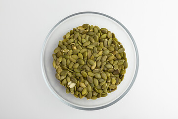 Top View of a Glass Bowl Filled With Fresh Green Pumpkin Seeds