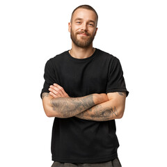 Confident bearded man with tattooed arms posing