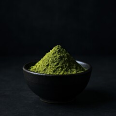 Hill of Green Tea Powder in Black Bowl on Dark Background, Emphasizing Minimalist Aesthetic in Stock Photography