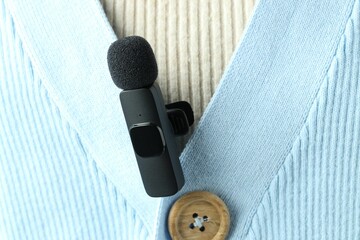 Woman with lavalier microphone on her shirt, closeup