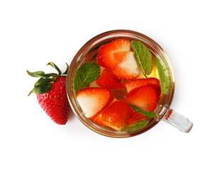 Aromatic fruit tea, strawberries and mint in glass cup isolated on white, top view