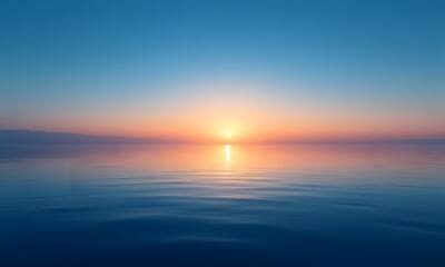Obraz premium A beautiful sunset on calm water.