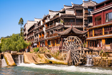 Fenghuang ancient town, China. Traditional chinese wooden houses in old watertown