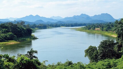 A wide river flows gently through lush green mountain landscapes
