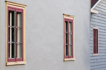 The exterior wall has a smooth grey cement finish, Harling, and wood clapboard siding. There are...