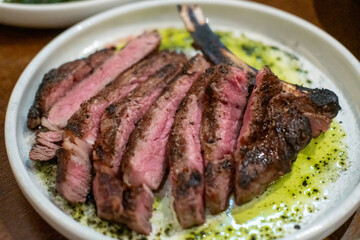 Medium rare angus steak served on plate