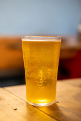 Glass of beer on the wooden table