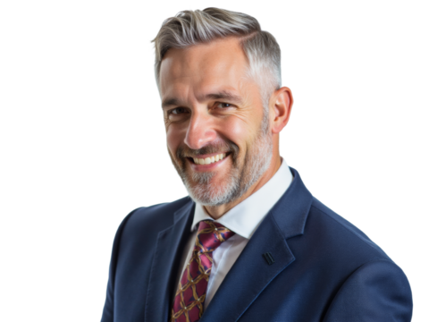 Business portrait isolated on white transparent background: A confident man with graying hair and a neatly trimmed beard smiles warmly at the camera while wearing a dark navy suit, white shirt, and  - Powered by Adobe