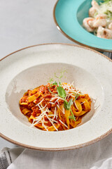 Rustic Tagliatelle Bolognese in Elegant Minimalist Presentation with Soft Pastel Aesthetics