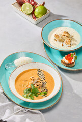 Artistic Presentation of Creamy Fish Soup and Tom Yum A Culinary Harmony in Vibrant Colors