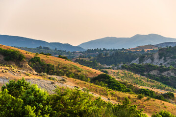 Fototapeta premium rural countryside landscape inside the badlands national Park during a sunny summer day, Val d'Agri, Basilicata