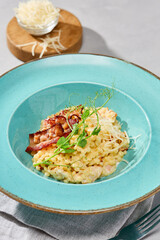 Gourmet Couscous Carbonara with Bacon Elegant Culinary Presentation in Vibrant Pastels