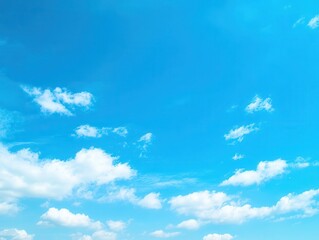 Obraz premium A vibrant, clear sky dotted with fluffy white clouds. A perfect day