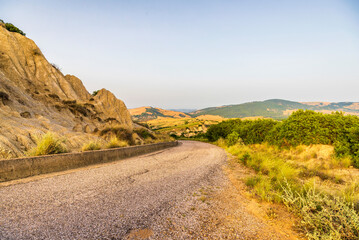 rural countryside landscape inside the badlands national Park during a sunny summer day, Val d'Agri, Basilicata