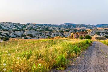 Obraz premium rural countryside landscape inside the badlands national Park during a sunny summer day, Val d'Agri, Basilicata