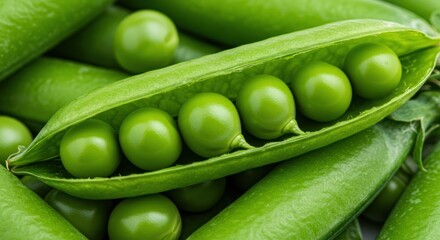 Close-up of green peas in a pod surrounded by more peas.