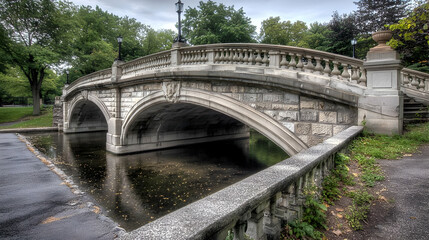 Fototapeta premium Ornate Stone Bridge Over Calm Water in Park
