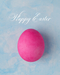 Easter pink egg on a blue background, Happy Easter card, poster, background