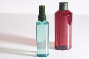 Red and Blue Transparent Cosmetic Bottles Together