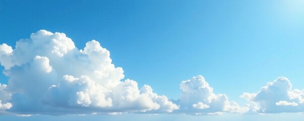 Cloudy blue sky with fluffy white clouds and gentle wisps of cirrus clouds in a soft focus background, cloud formation, blue sky
