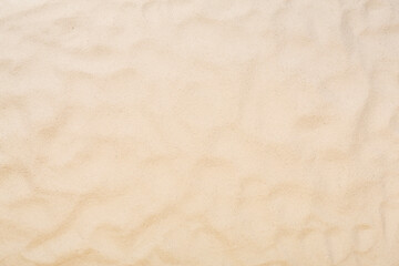 Textured beach sand as background, top view