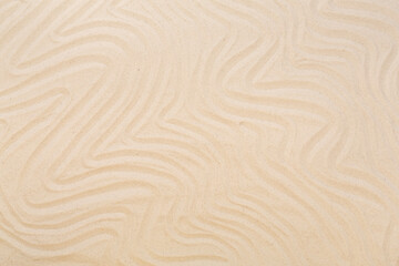 Textured beach sand as background, top view