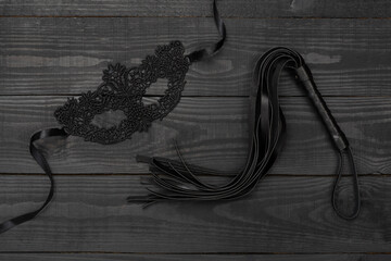 Woman's erotic lingerie on wooden background, top view