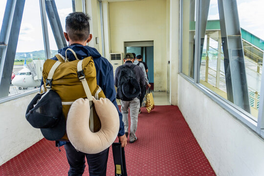 Passengers Waiting in Line for Their Flight