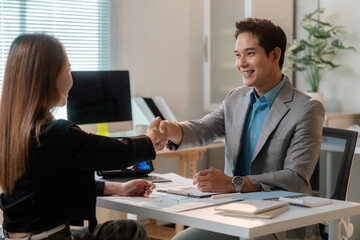 Fototapeta premium Business partners shaking hands during a meeting in the office