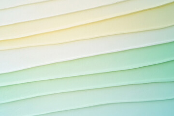Serene layers of pastel hues transitioning from warm ivory to cool mint, a gentle gradient evoking calmness and tranquility in a soft, textured abstract.