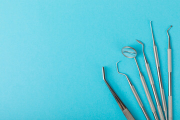 Dentist tools on a blue background. Dentist Concept.Teethcare, dental health concept. Means to care...