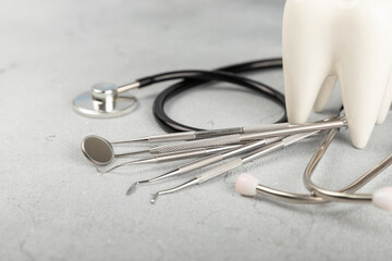 Dentist tools on a blue background. Dentist Concept.Teethcare, dental health concept. Means to care for the oral cavity. Dental model and dental equipment. Dental hygiene. Space for text. Copy space. © Avocado_studio