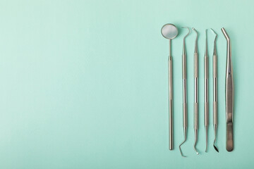 Dentist tools on a blue background. Dentist Concept.Teethcare, dental health concept. Means to care for the oral cavity. Dental model and dental equipment. Dental hygiene. Space for text. Copy space.