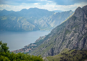 Fototapeta premium Kotor Bay, Montenegro, Mountains meet the sea, dotted with towns and trees