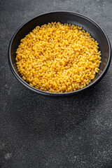 Macaroni pasta raw coquillette appetizer dish organic product fresh tasty gourmet food background on the table rustic food top view copy space