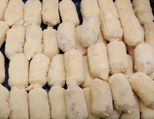 Croquettes prepared to be cooked in the pan