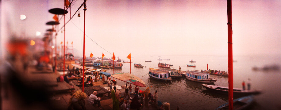 Panoramic view of people at a riverbank, Ganges River, Varanasi, Uttar Pradesh, India.