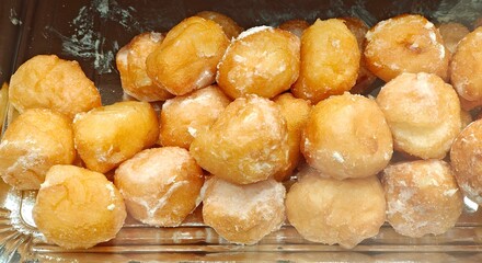 Cream profiteroles in the pastry shop.