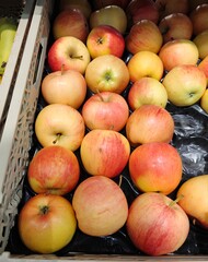 Box of organic apples in the supermarket.