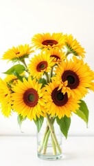 Obraz premium Vibrant yellow sunflowers in a clear glass vase, sunny bouquet, yellow, yellow flowers