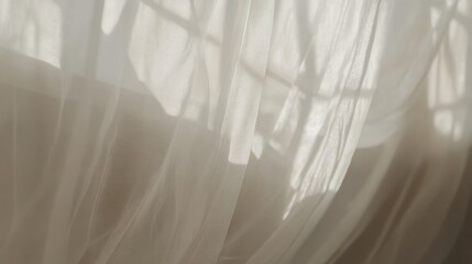 Translucent curtains create shadows from sunlight through a window