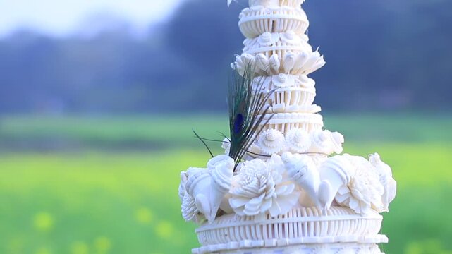 Topor , a conical white shola pith headgear, worn during Hindu wedding ceremonies. Symbolizing purity and cultural heritage, A traditional Bengali groom&rsquo;s hat is a key part of Bengali wedding rituals.