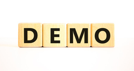 Demo symbol. Concept word Demo on beautiful wooden blocks. Beautiful white table white background....