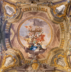 FLORENCE, ITALY - MARCH 19, 2025: The baroque fresco of angels with the cross in the church...